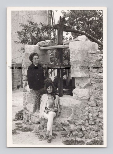 Old photo women stone - b&w,