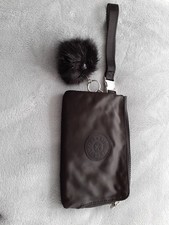 A BLACK POUCH/WRISTLET PURSE BY KIPLING BRAND NEW WITHOUT TAGS.