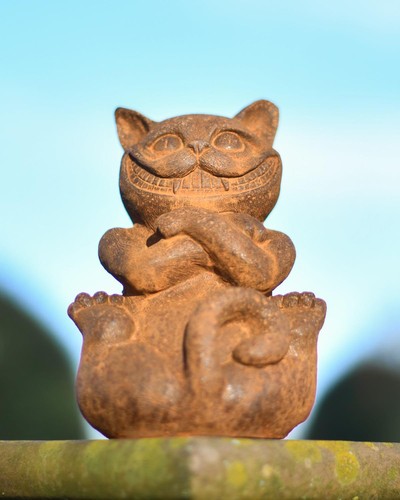 Rustic grinning cheshire cat - rustic, "grinning"