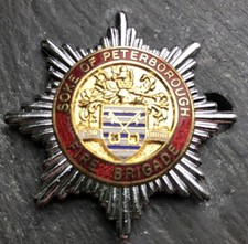 SOKE OF PETERBOROUGH FIRE BRIGADE CAP BADGE.