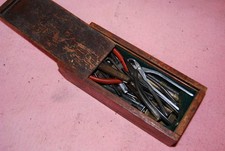 A Box of Tools and Various Items From A Watch Menders Bench.