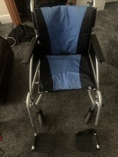 Wheelchair. A modern lightweight foldable wheelchair with removable footrests.