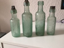 4 old green glass bottles
