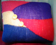 Hand knitted cushion complete
