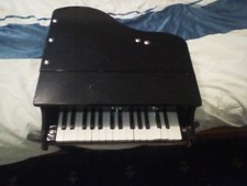 mini grand piano black colour in need of repair 50cmx 50cm 