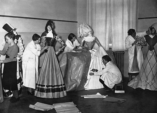 Student seamstresses putting