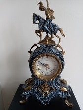 Rococo style mantel clock. Verdgri with warrier on horseback.  