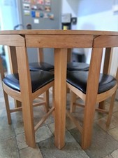 round table with interlocking chairs a space saver