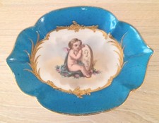 ANTIQUE HANDPAINTED PORCELAIN TRINKET DISH OF A BABY LOOKING IN MIRROR, c1900