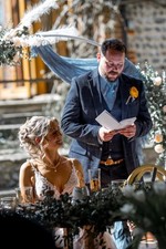 White Wedding arch moon gate with faux flower arrangement