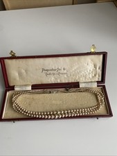 vintage pearl necklace   Pompadour.  Needs Fixing   3 Strings.  Original Box