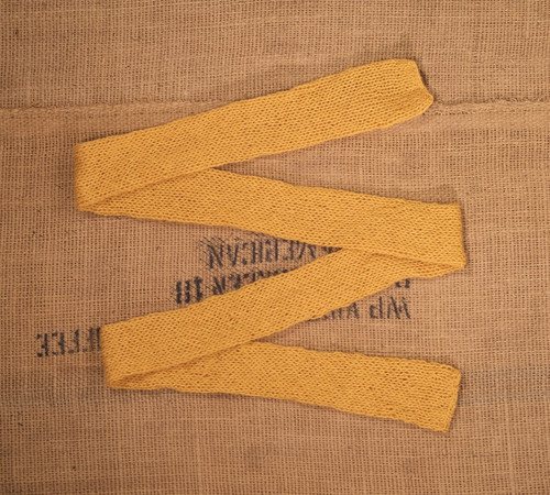 Long yellow skinny scarf neck