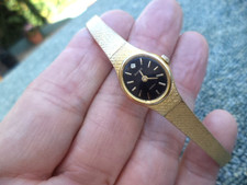 Accurist  Ladies Bracelet Watch, gold strap & chain, new battery ,model  940000