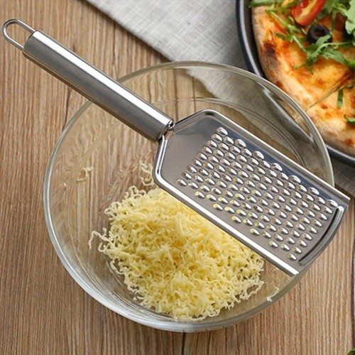 Hand held cheese grater with - cheese,