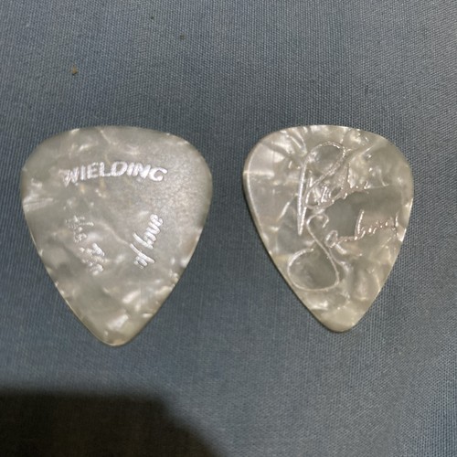 Wielding guitar picks - picks, air