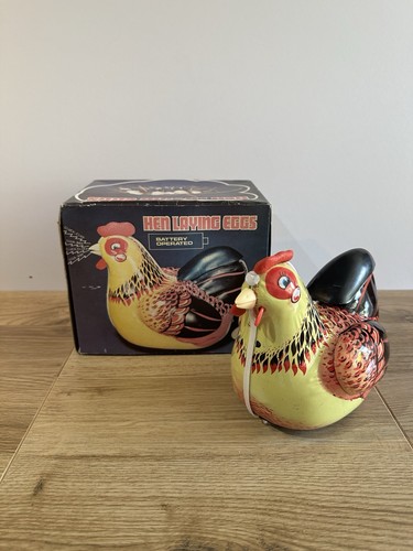 Hen laying eggs battery - laying,