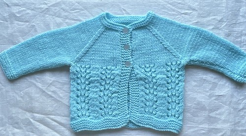 Handknitted aqua baby