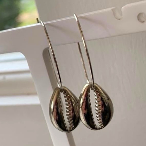 Silver tone metal cowrie shell - tone,