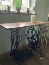 Refurbished table with singer sewing machine base. Oak Topped
