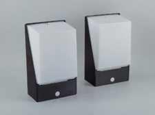 Thorn Preinet, England. A pair of wall lamps. Black metal and acrylic shades.