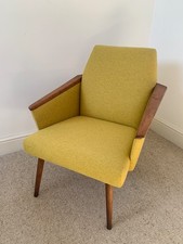 Mustard yellow East German Mid century armchair with wood arms, retro, vintage. 