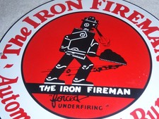 VINTAGE IRON FIREMAN ROBOT