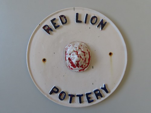 Red lion pottery advertising - red,