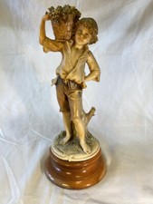 G Armani Boy with basket of