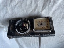 Vintage Smiths clock and Lucas amps meter in binnicle