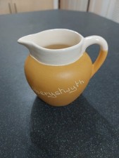 A Devonmoor Pottery Cream Jug With Aberystwyth Impressed 10cm Tall