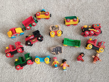 Bundle of vintage Brio toy train engines, carriages and characters