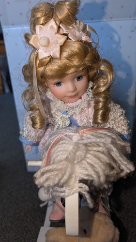 Porcelain doll rocking - doll, on