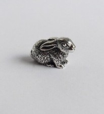 Rabbit crouched figurine