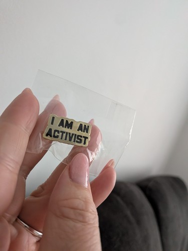 Pin badge an activist - badge, am
