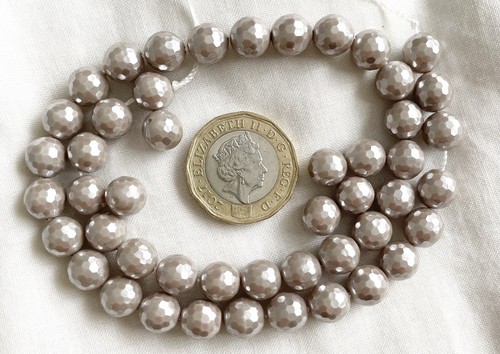 Faceted shell pearls bought - faceted,