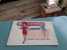 COMIC POSTCARD LARGE STICK OF SEASIDE ROCK MAN & LADY ON BEACH SWIMMING COSTUMES