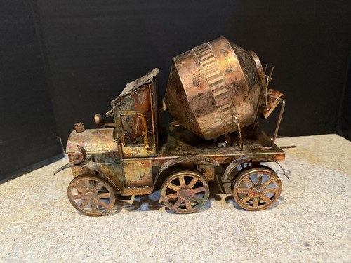 Vintage tin wind - wind-up, cement