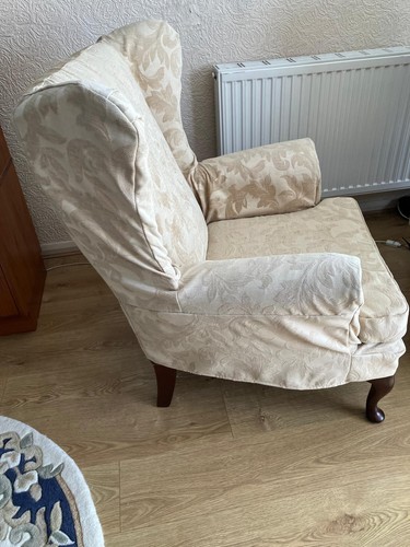 Fabric wing back chair used.