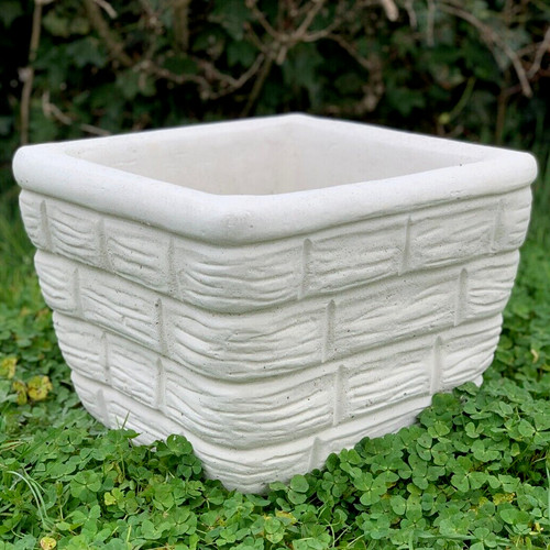 Concrete plant pot with brick