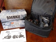 Superb ABU Garcia 506 MK11 in unused condition with spare spools ,paperwork, bag