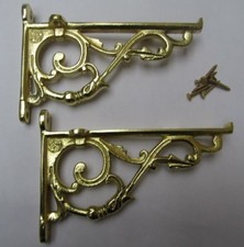 PAIR OF SMALL LIPPED BRASS