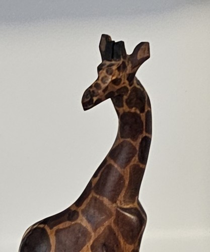 Hand carved wooden giraffe - hand,