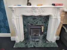 White Fireplace Surround And Green Marble Surrounding