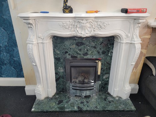 White fireplace surround and - surround,