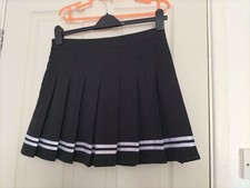 Ladies Pleated Gym/Games Skirt. Black with White Trim. Fitted Pants.Side Zip.