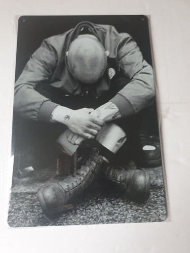 Skinhead man sitting metal - sitting,