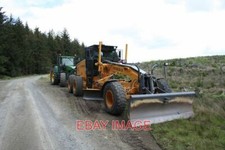 PHOTO  THROSS BURN EQUIPMENT USED FOR GRADING AND COMPACTING FORESTRY ROADS. 200