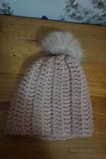 Pink knitted bobble hat