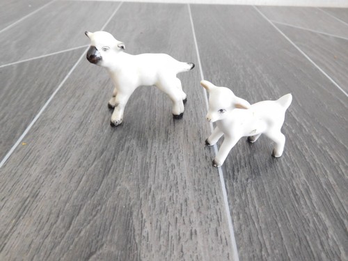 Ceramic lambs possibly - 2, (