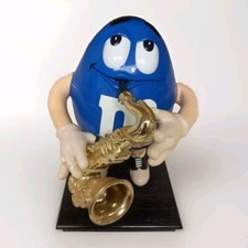 M&M Dispenser Blue Peanut Playing Saxophone | H26cm X W16cm | Mars Collectables